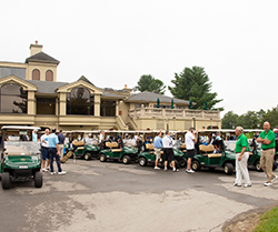 Golf carts lined up outside Toftrees pro shop