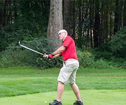 golfer swinging a driver