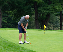 golfer putting on the green