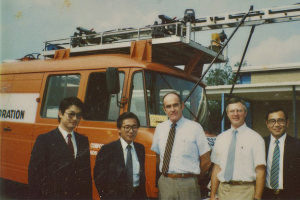 Group photo of three PASCO reps and Tom Larson and Walt Kilareski